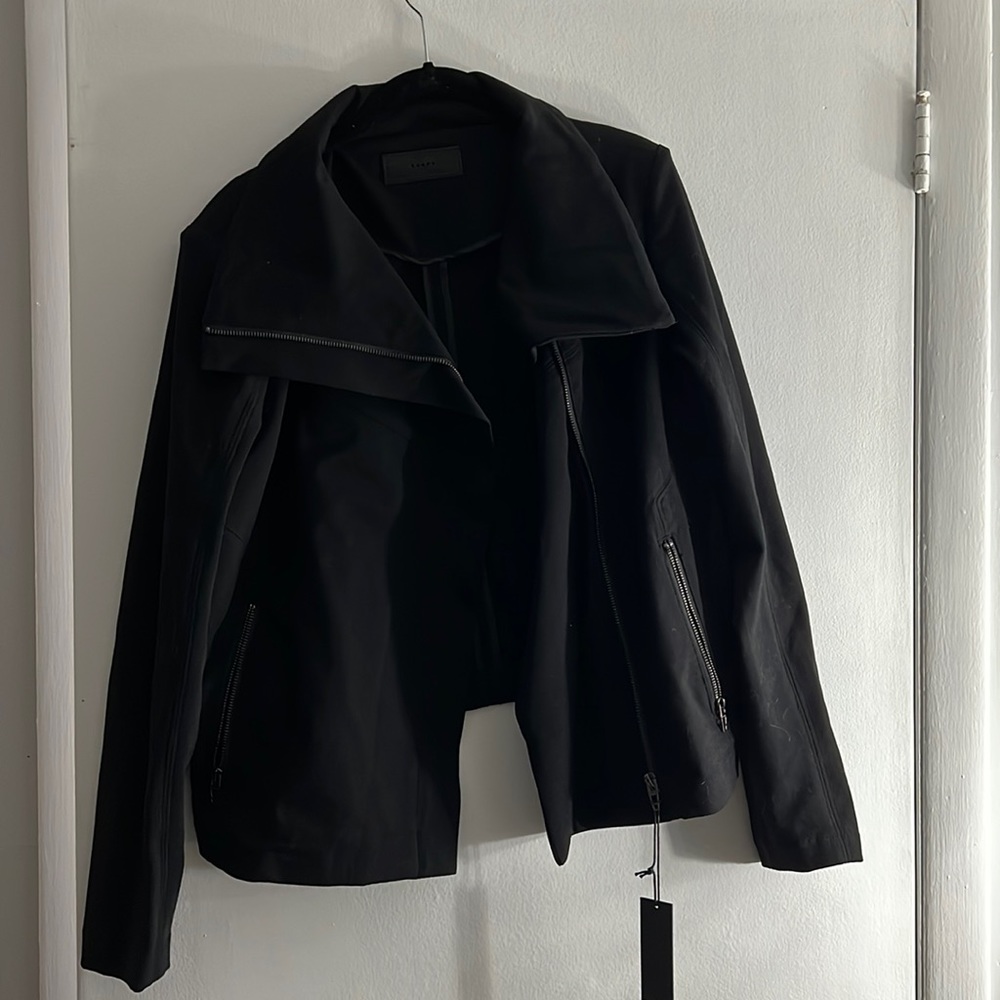 Women black BlankNYC size medium jacket. Off center zipper with shoulder pads
